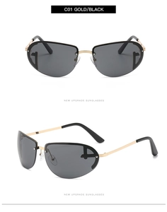 Detail view of gold metal frame sunglasses with black oval lenses and T-shape decor