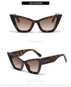 Détail de lunettes de soleil œil-de-chat léopard avec verres dégradés marron