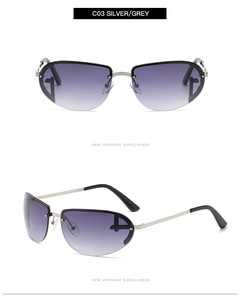 Detail of silver oval Y2K sunglasses with gradient lenses and unique hollow metal frame