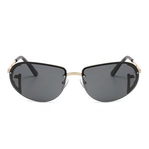 Retro oval Y2K sunglasses with dark lenses and elegant gold metal T-shaped accents