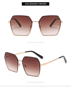 Detail view of large gradient brown square sunglasses with gold metal frame and bridge