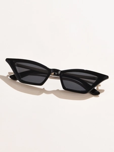 Detail of black cat-eye sunglasses with dark lenses and elegant metallic hinge design