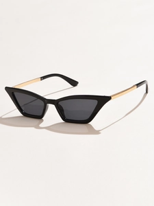 Detail of cat eye sunglasses featuring black frames and gold metal temples on white background