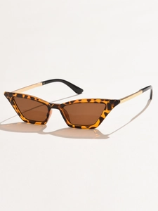 Detail view of retro cat eye sunglasses with tortoise frame and gold metal temples