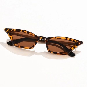 Modern cat eye sunglasses with dark tortoise shell frame and brown lenses at a 45-degree angle