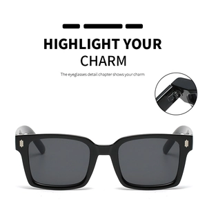 Detailed view of square black sunglasses frame with metallic rivets and hinge construction