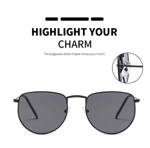 Detailed view of adjustable silicone nose pads on thin black metal frame sunglasses