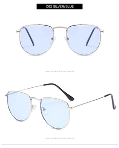 Detailed close-up of silver metal frame aviator sunglasses with light blue lenses