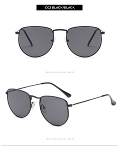 Detail of minimalist black metal frame sunglasses featuring premium black polarized lenses