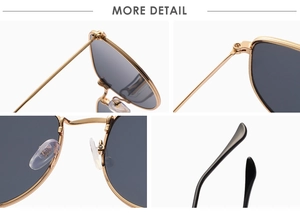 Detail view of gold metal frame sunglasses featuring silicone nose pads and hinges