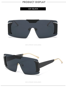 Front and side view of frameless oversized black sunglasses with gold metal accents
