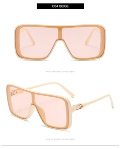 Detail of beige oversized square sunglasses with light pink lenses and metal hinges