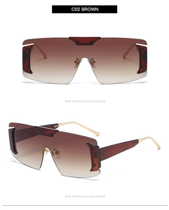 Detail view of C02 Brown oversized rimless shield sunglasses with gold metal temples