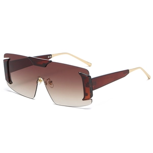 Modern rimless oversized sunglasses with brown gradient lenses and gold metal temples