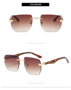 Detail view of rimless rectangle sunglasses with brown gradient lenses and gold hardware