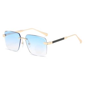 Lunettes de soleil carrées sans monture avec verres dégradés bleu et cadre en métal doré