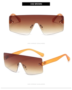 Close-up of C02 brown gradient rimless sunglasses with orange translucent temples