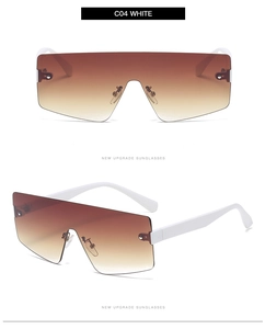 Detail view of oversized rimless gradient brown sunglasses with white temples