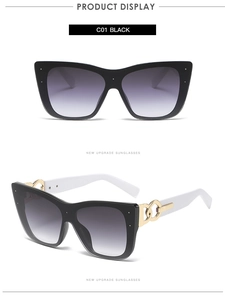Detailed close-up showing white temples with golden interlocking ring hinge on cat-eye sunglasses