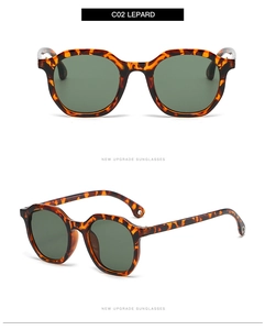 Detail view of vintage leopard frame sunglasses with dark green lenses and metal accents