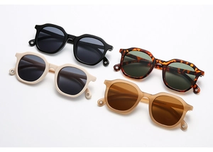Flat lay of small polygon sunglasses in black, tortoiseshell, beige and tea brown colors