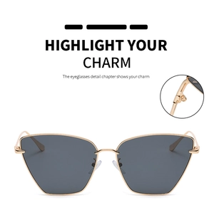 Detail des verstärkten Metallscharniers und des goldenen Cat-Eye-Rahmens der Sonnenbrille
