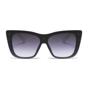 Women's cat eye sunglasses in black with gradient lenses and silver rivet details