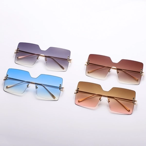 Four pairs of trendy oversized square gradient sunglasses with sleek gold metal frames