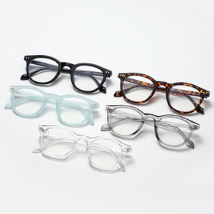 Retro round glasses frames set in diverse colors with rivet accents and blue light filter