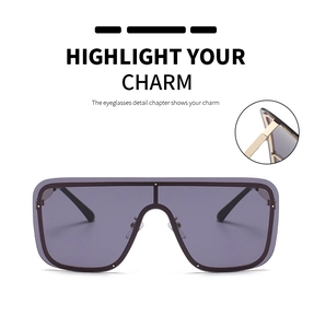 Detail of metal hinge on oversized flat top square sunglasses with purple tinted lens