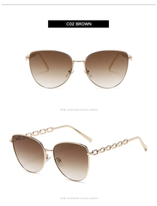 Détail des branches en chaîne dorée et verres dégradés bruns sur lunettes oversize