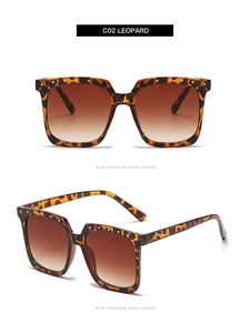 Detail of leopard print square sunglasses with gold rivets and brown gradient lenses