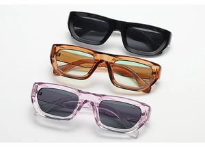 Three pairs of vintage rectangle sunglasses in black, amber orange, and purple hues