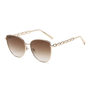 Lunettes de soleil œil-de-chat pour femmes avec branches chaîne dorée et verres dégradés