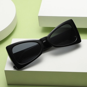 Chic black cat eye triangular sunglasses for women with matte frames and dark lenses