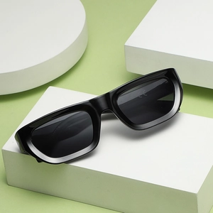 Classic black rectangular sunglasses with dark lenses and CE certification on a clean display