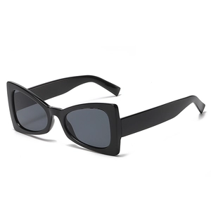 Classic black chunky cat eye sunglasses with dark grey lenses and a glossy finish