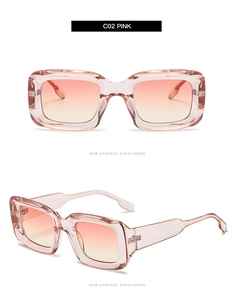 Close-up of square frame sunglasses in transparent pink resin with gradient lenses