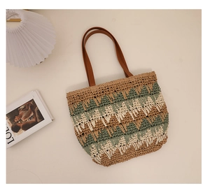 Close-up of vintage wavy pattern straw tote bag with brown leather shoulder straps