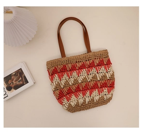 Macro detail of tricolor wavy woven straw bag with premium leather shoulder straps