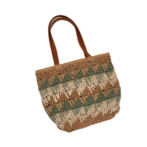 Large woven straw shoulder bag with multi-color wave patterns and brown handles