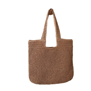 Minimalist dark brown hand-woven straw tote bag for summer beach or casual daily use
