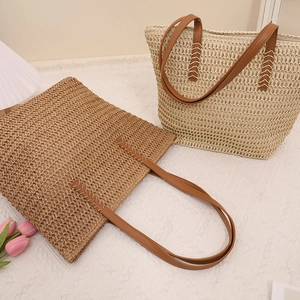 Handwoven straw tote bag set with brown leather straps and zip closure for summer travel