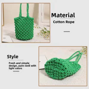 Detail of emerald green handmade cotton rope woven bucket bag with hollow mesh design