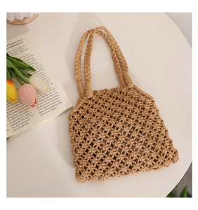 Detailed macro of hollow diamond mesh weave on a khaki cotton rope beach tote bag