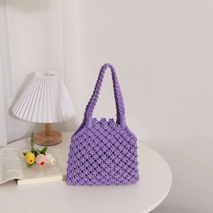 Handmade purple hollow knit cotton rope handbag for summer beach vacations