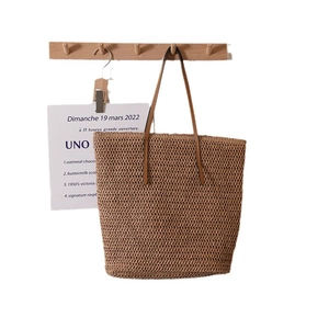 Minimalist large capacity straw woven tote bag with brown straps for summer beach vacation