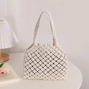 Minimalist beige woven cotton cord tote bag with bohemian knot pattern for beach vacation