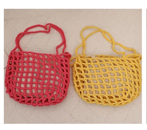 Detail of woven mesh beach bags with drawstring inner pouches and cotton rope texture