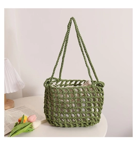 Detail of green woven mesh bag with white drawstring liner and durable cotton handles
